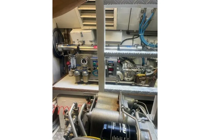  Yacht Photos Pics Engine room of 2009 Overmarine Mangusta 72 HT yacht, showcasing mechanical components and wiring.