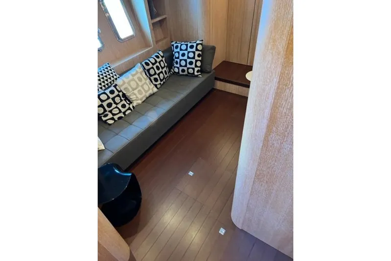  Yacht Photos Pics Luxurious interior of 2009 Overmarine Mangusta 72 HT yacht with modern seating and cushions.