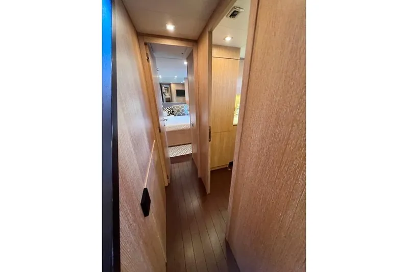  Yacht Photos Pics Hallway view inside 2009 Overmarine Mangusta 72 HT yacht, featuring wooden interior design.