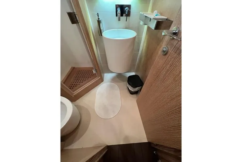  Yacht Photos Pics Luxurious bathroom in 2009 Overmarine Mangusta 72 HT yacht, featuring modern sink and shower.