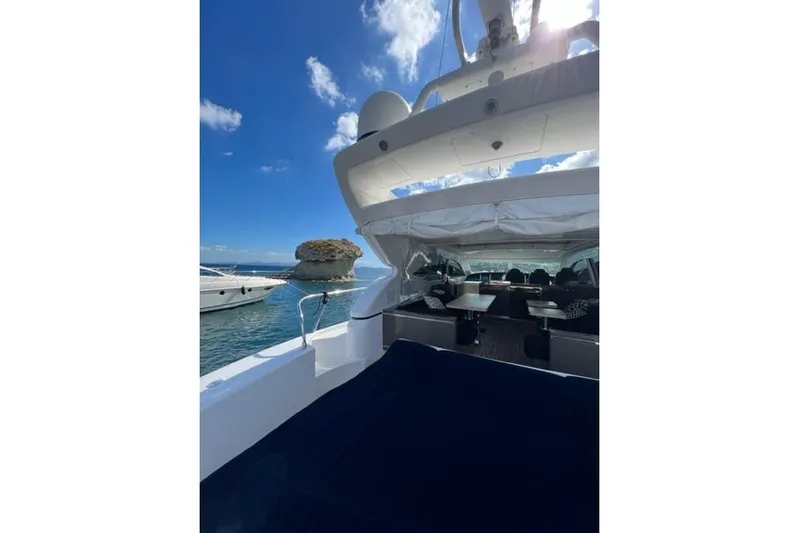  Yacht Photos Pics Luxurious 2009 Overmarine Mangusta 72 HT yacht with spacious deck and scenic ocean view.
