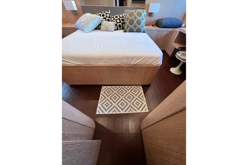  Yacht Photos Pics Luxurious bedroom interior of 2009 Overmarine Mangusta 72 HT yacht with modern decor.