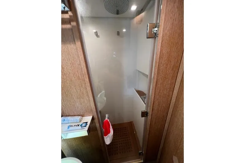  Yacht Photos Pics Shower area in 2009 Overmarine Mangusta 72 HT yacht with wooden accents.