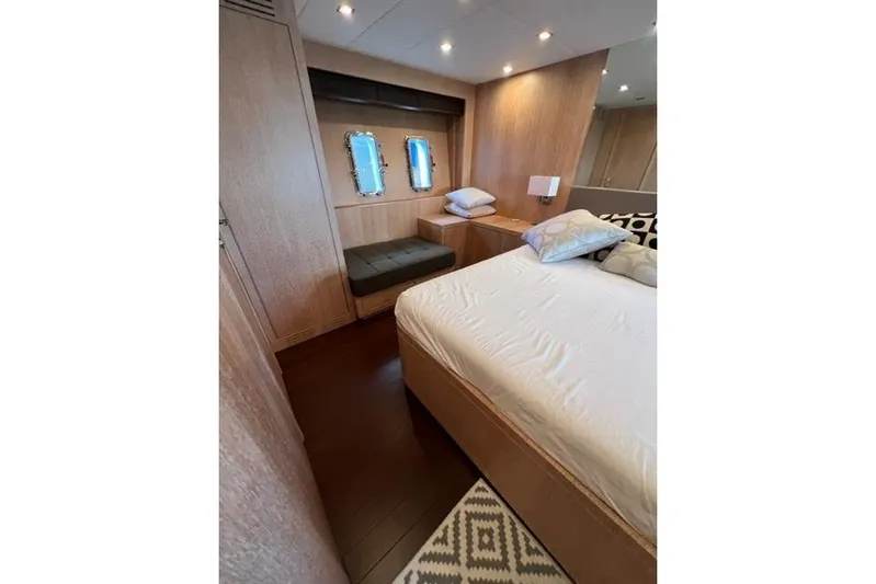 Yacht Photos Pics Luxurious bedroom interior of 2009 Overmarine Mangusta 72 HT yacht with modern design.