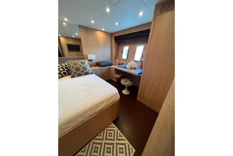  Yacht Photos Pics Luxurious bedroom interior of 2009 Overmarine Mangusta 72 HT yacht with modern decor.