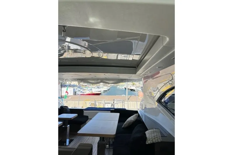  Yacht Photos Pics Interior view of 2009 Overmarine Mangusta 72 HT yacht with open seating area.