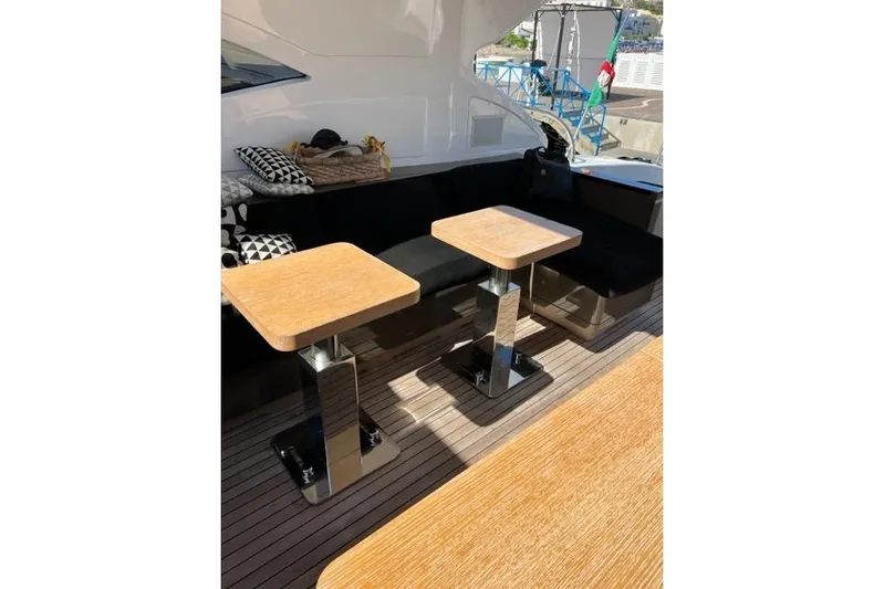  Yacht Photos Pics Luxurious 2009 Overmarine Mangusta 72 HT yacht deck with elegant seating and tables.