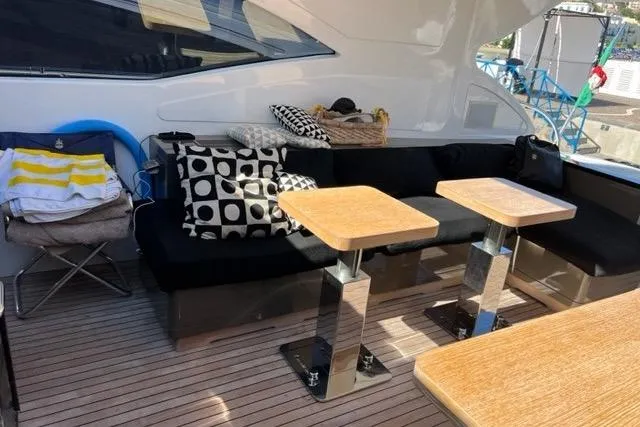  Yacht Photos Pics Luxurious 2009 Overmarine Mangusta 72 HT yacht deck with stylish seating and tables.