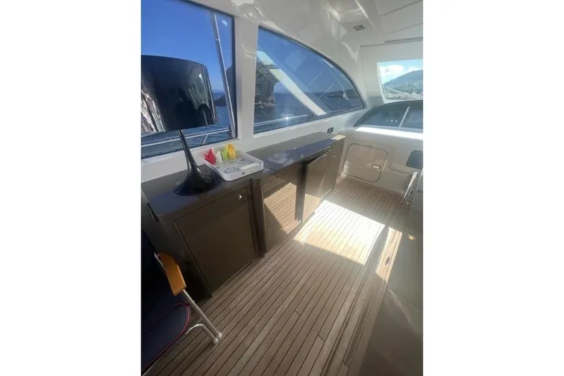  Yacht Photos Pics Interior of 2009 Overmarine Mangusta 72 HT yacht with sleek design and wooden flooring.