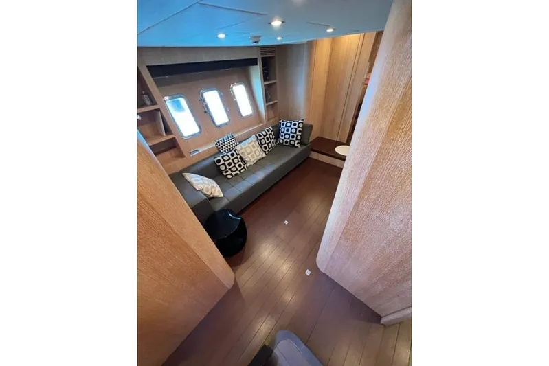  Yacht Photos Pics Luxurious interior of 2009 Overmarine Mangusta 72 HT yacht with modern seating and decor.