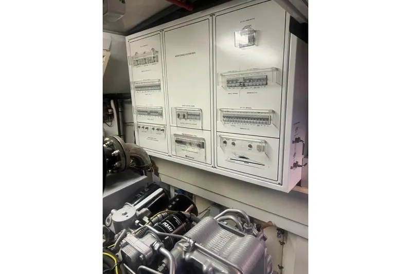  Yacht Photos Pics Engine room of 2009 Overmarine Mangusta 72 HT yacht, featuring control panels and machinery.