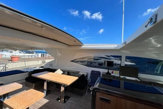  Yacht Photos Pics Luxurious 2009 Overmarine Mangusta 72 HT yacht interior with open deck and seating area.