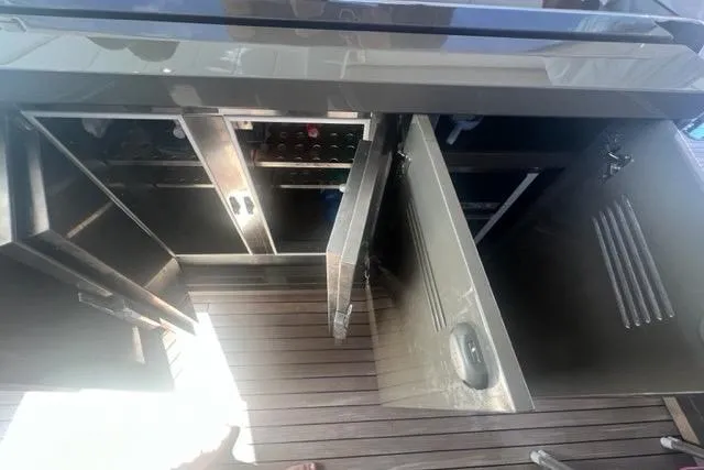  Yacht Photos Pics Open storage compartments on 2009 Overmarine Mangusta 72 HT yacht deck.