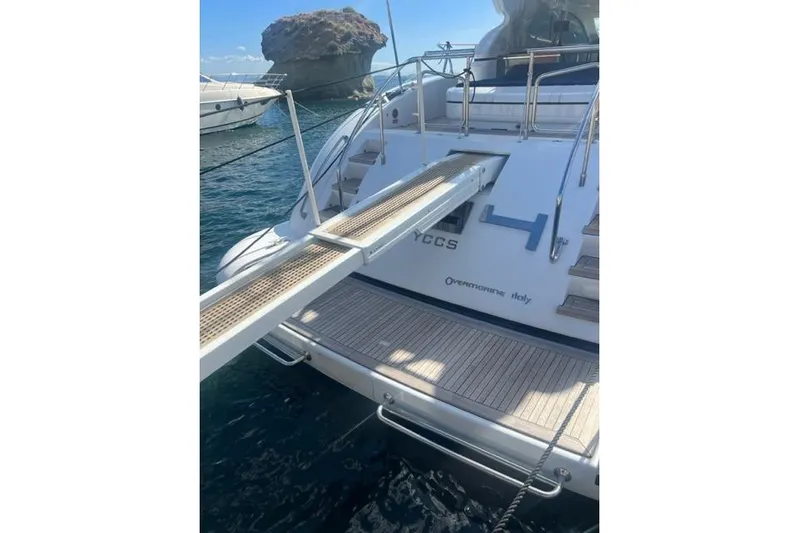  Yacht Photos Pics Luxury Overmarine Mangusta 72 HT yacht, 2009 model, docked with gangway extended.