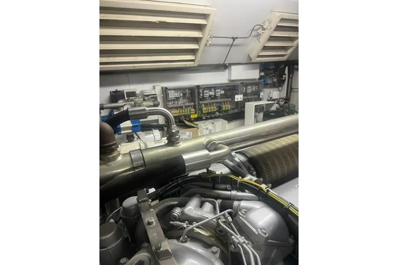  Yacht Photos Pics Engine room of 2009 Overmarine Mangusta 72 HT yacht, showcasing mechanical components and control panels.