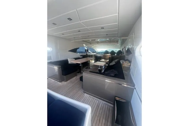  Yacht Photos Pics Luxurious interior of 2009 Overmarine Mangusta 72 HT yacht with elegant seating and tables.