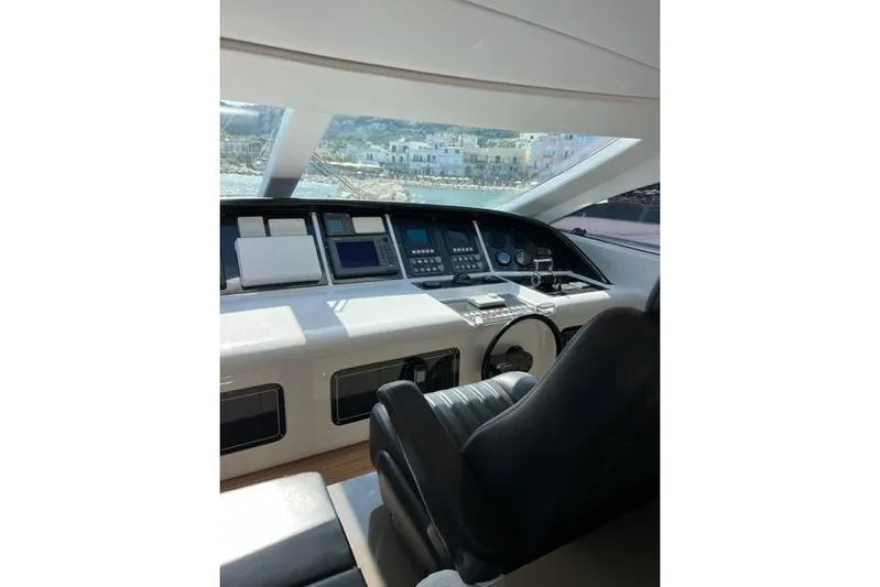  Yacht Photos Pics Cockpit of 2009 Overmarine Mangusta 72 HT yacht with modern navigation equipment.