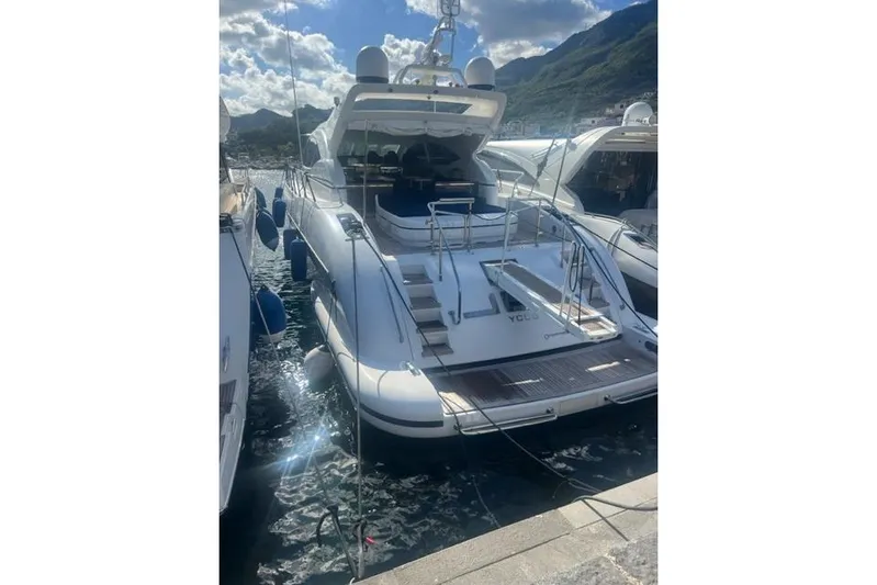  Yacht Photos Pics Luxury 2009 Overmarine Mangusta 72 HT yacht docked in scenic marina.