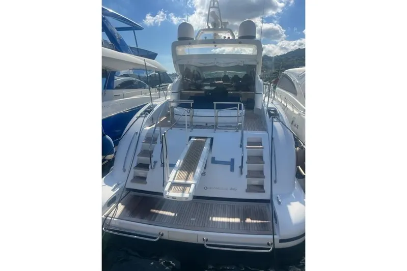  Yacht Photos Pics Luxury Overmarine Mangusta 72 HT yacht, 2009 model, docked with sunlit deck and sleek design.