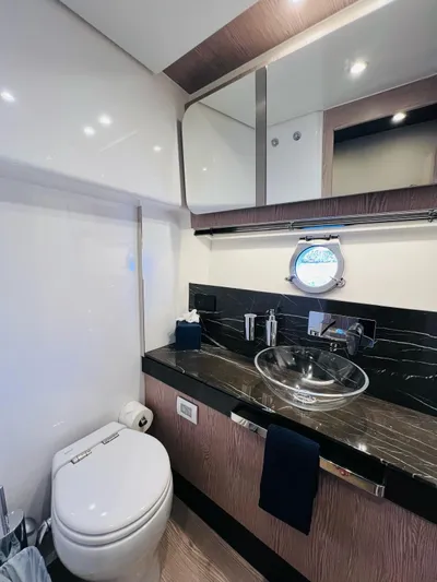  Yacht Photos Pics Luxurious bathroom in 2022 Azimut S6F yacht with modern fixtures and elegant design.