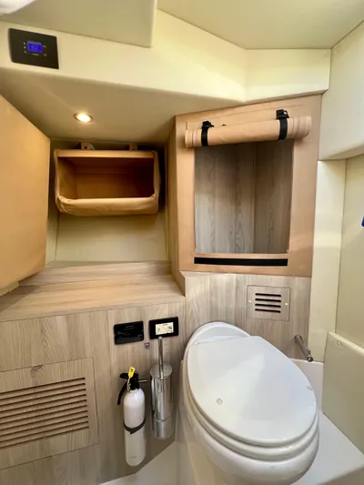  Yacht Photos Pics 2022 Azimut S6F yacht bathroom with modern fixtures and wooden cabinetry.