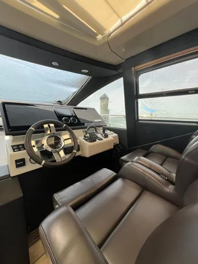  Yacht Photos Pics Luxurious 2022 Azimut S6F yacht cockpit with leather seating and modern controls.