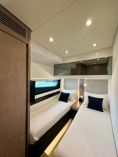  Yacht Photos Pics Luxurious 2022 Azimut S6F yacht cabin with twin beds and modern lighting.