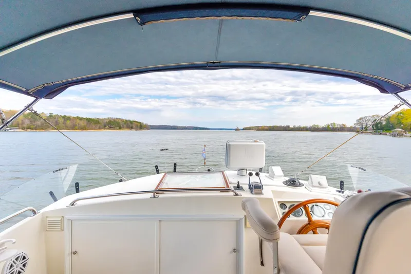 Lu-sea-lu Yacht Photos Pics 1994 Grand Banks 42 Classic yacht helm with scenic lake view.