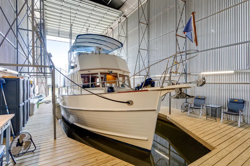 Lu-sea-lu Yacht Photos Pics 1994 Grand Banks 42 Classic yacht docked in a spacious indoor marina.