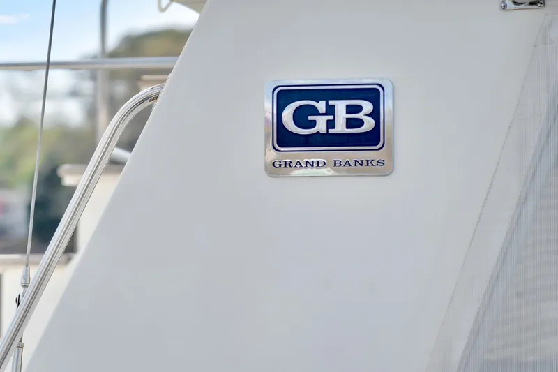 Lu-sea-lu Yacht Photos Pics 1994 Grand Banks 42 Classic yacht logo on white surface.