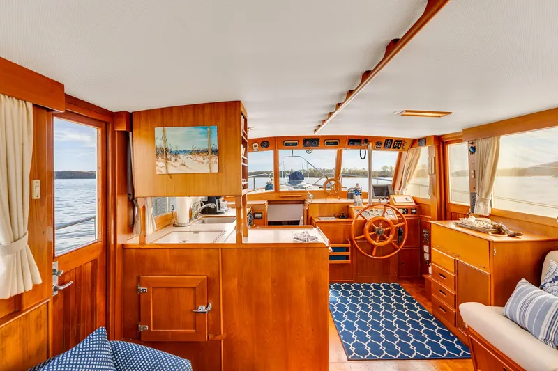 Lu-sea-lu Yacht Photos Pics Interior of a 1994 Grand Banks 42 Classic yacht with wooden finishes and nautical decor.
