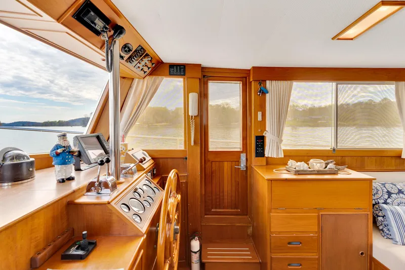 Lu-sea-lu Yacht Photos Pics Interior of 1994 Grand Banks 42 Classic yacht with wooden finish and nautical decor.