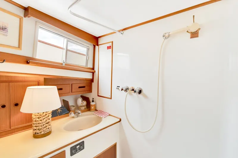 Lu-sea-lu Yacht Photos Pics Bathroom interior of 1994 Grand Banks 42 Classic yacht, featuring sink and shower.