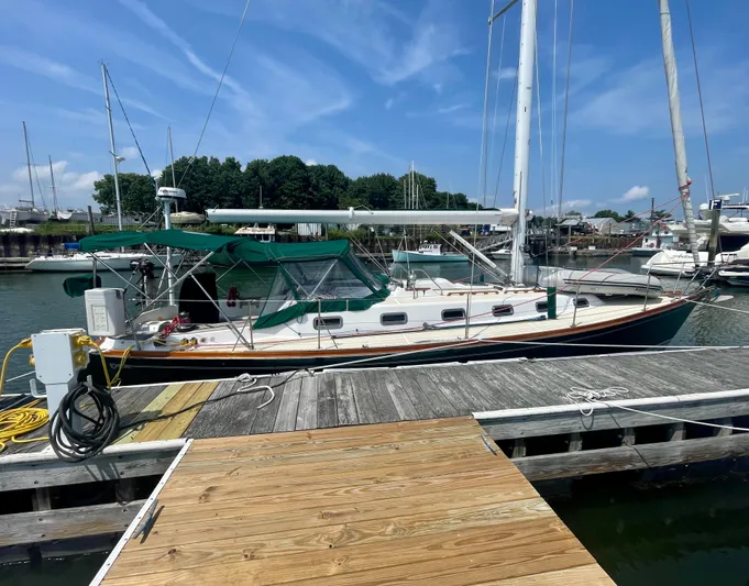  Yacht Photos Pics 2001 Tartan 4100 sailboat docked at marina under clear blue sky.