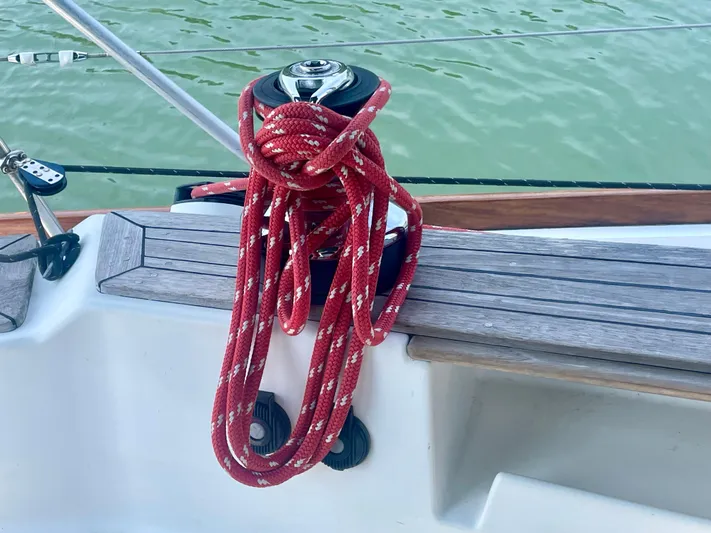 Yacht Photos Pics Red rope on Tartan 4100 sailboat winch, 2001 model, by the water.