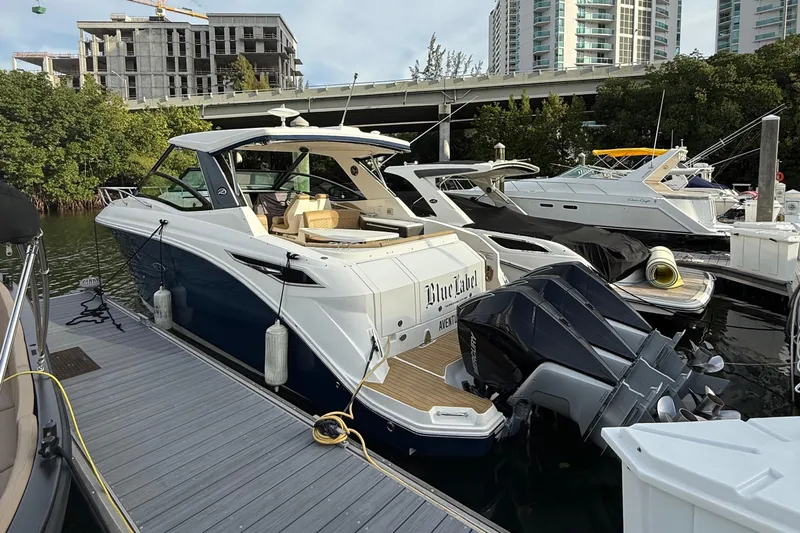  Yacht Photos Pics 2021 Sea Ray Sundancer 320 Coupe OB docked, featuring sleek design and modern amenities.