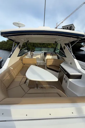  Yacht Photos Pics 2021 Sea Ray Sundancer 320 Coupe OB, spacious cockpit with seating and table, luxury design.