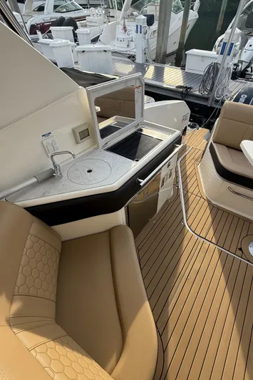  Yacht Photos Pics 2021 Sea Ray Sundancer 320 Coupe OB, luxurious deck with seating and kitchenette.