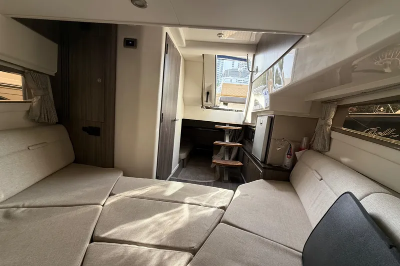  Yacht Photos Pics Interior of 2021 Sea Ray Sundancer 320 Coupe OB, featuring cozy seating and modern design.