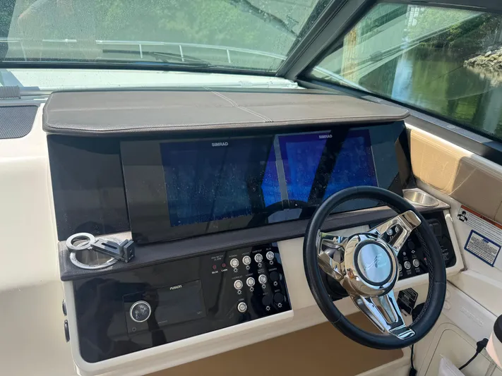  Yacht Photos Pics 2021 Sea Ray Sundancer 320 Coupe Outboard helm with Simrad displays and modern controls.