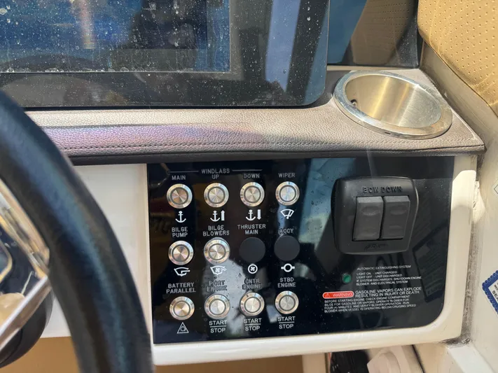  Yacht Photos Pics Control panel of 2021 Sea Ray Sundancer 320 Coupe Outboard with various switches and buttons.