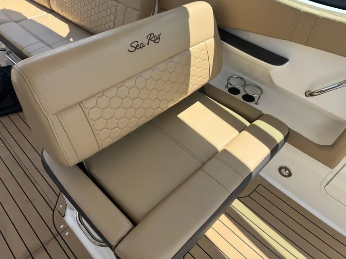  Yacht Photos Pics Luxury seating on 2021 Sea Ray Sundancer 320 Coupe Outboard boat, featuring tan upholstery.