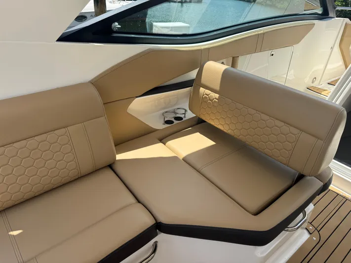  Yacht Photos Pics 2021 Sea Ray Sundancer 320 Coupe Outboard interior with tan leather seating and cup holders.