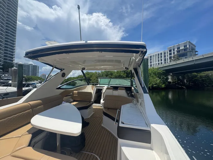  Yacht Photos Pics 2021 Sea Ray Sundancer 320 Coupe Outboard docked, featuring spacious seating and sleek design.