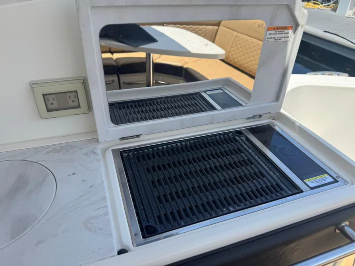  Yacht Photos Pics Outdoor grill on 2021 Sea Ray Sundancer 320 Coupe Outboard yacht, featuring a sleek countertop design.