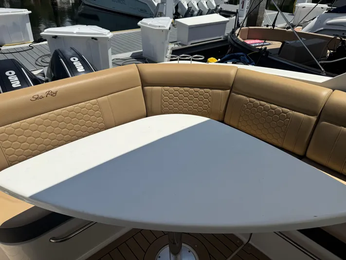  Yacht Photos Pics 2021 Sea Ray Sundancer 320 Coupe Outboard with tan seating and white table on deck.