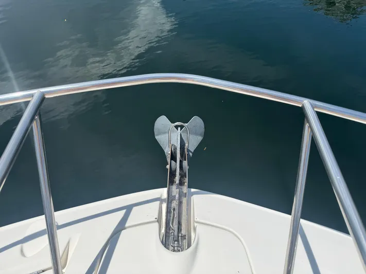  Yacht Photos Pics Bow view of 2021 Sea Ray Sundancer 320 Coupe Outboard with anchor and railing.