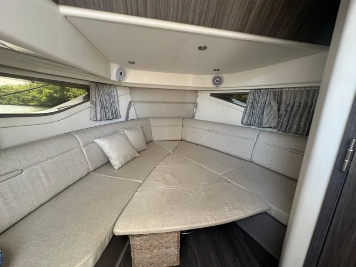  Yacht Photos Pics 2021 Sea Ray Sundancer 320 Coupe Outboard interior with elegant gray seating and modern design.