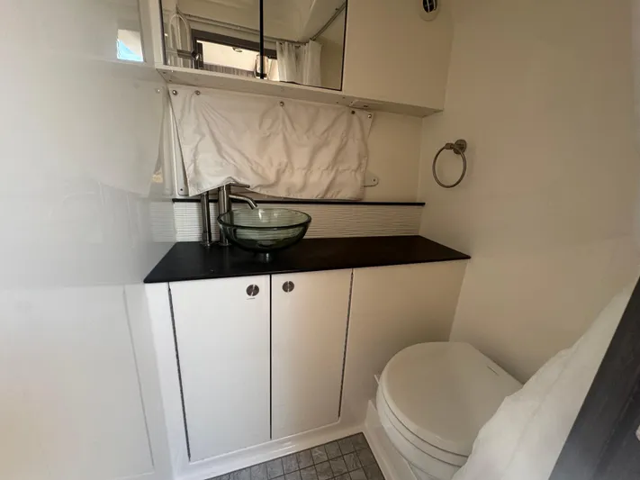  Yacht Photos Pics 2021 Sea Ray Sundancer 320 Coupe Outboard bathroom with modern sink and toilet.