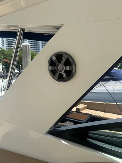  Yacht Photos Pics 2021 Sea Ray Sundancer 320 Coupe Outboard, exterior speaker detail, docked at marina.